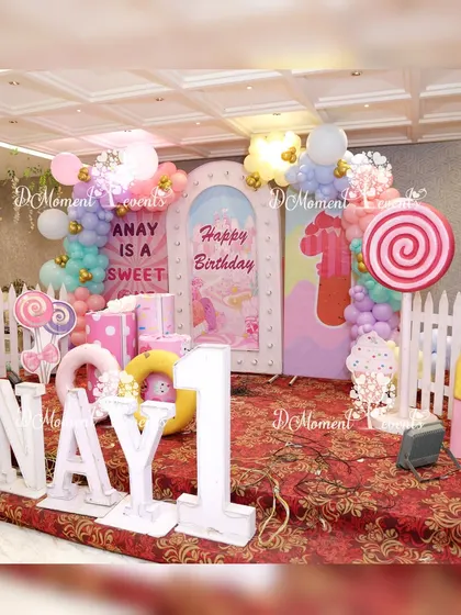 A wide view of the Candyland stage, showing the large marquee letters and various sweet-themed props.