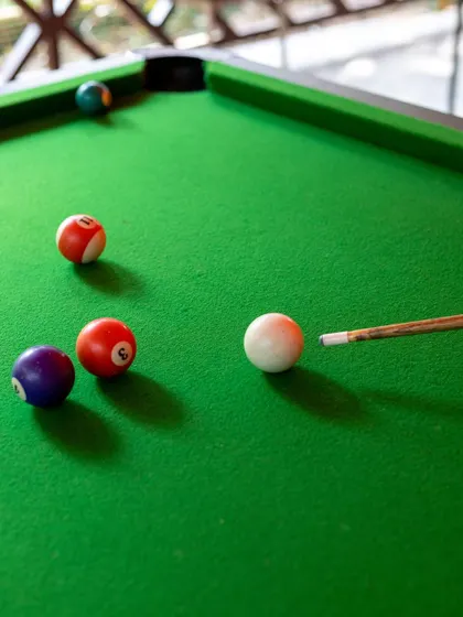 A close-up of a well-played game of pool, capturing the fun and competitive spirit of our indoor activities.