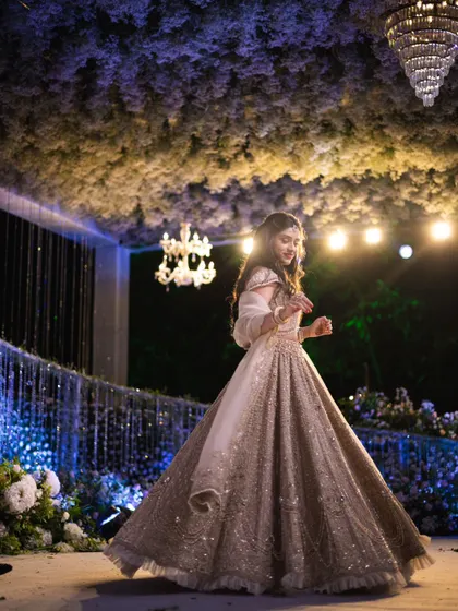 Mahima enjoying a dance at her engagement party. The makeup is designed to be long lasting and beautiful in motion, perfect for a night of celebration.