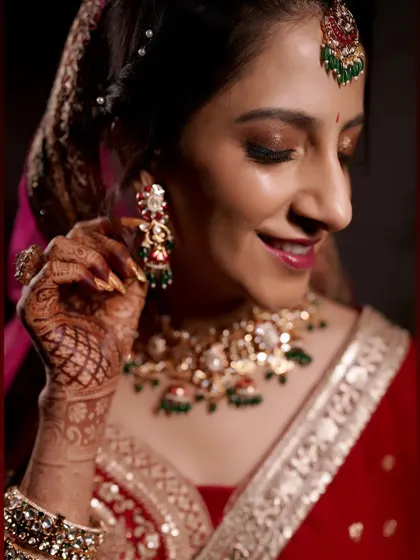 A beautiful profile shot capturing the bride's happy expression and the classic brown smokey eye I created for her reception.