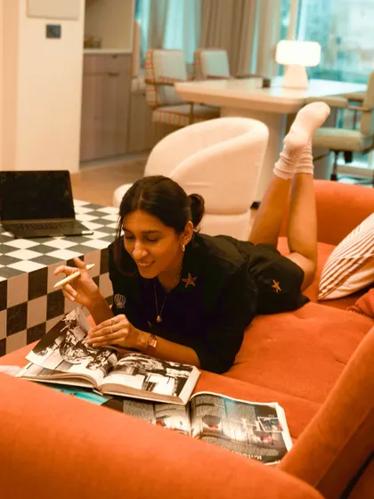 My creative process isn't always at a desk. Sometimes the best ideas come from lounging on the sofa, flipping through reference books and magazines to find that spark of inspiration for the next project.
