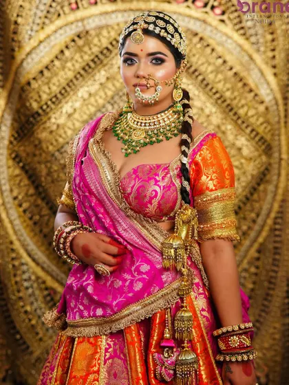 This portrait captures the bride's confident and regal presence, a result of professional makeup and styling that enhances natural beauty.