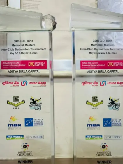 A close-up of the two trophies from my double crown win at the 30th G.D. Birla Memorial Masters Inter-Club Badminton Tournament.