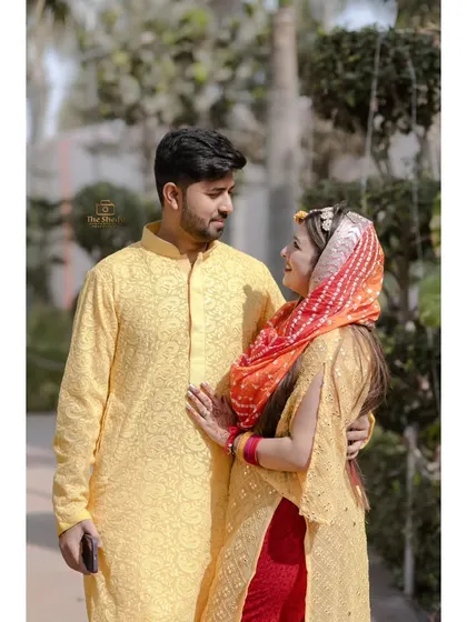 A romantic portrait of a couple during their Haldi ceremony. Their coordinated yellow outfits and loving gaze make this a perfect couple shot.