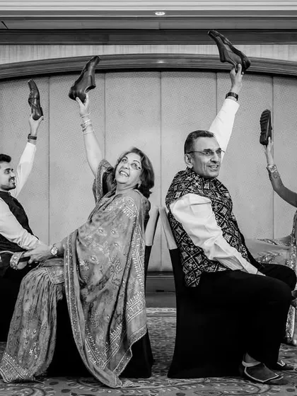 The shoe game in action. This fun reception game always results in hilarious, candid moments, captured here in timeless black and white.