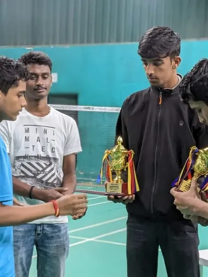 A closer look at the champions and their trophies, a symbol of their hard work and victory.