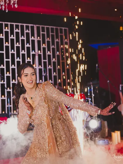 The bride's solo performance amidst smoke and sparklers. A true star moment on her special night.