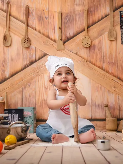 Little chef Vivaan is hard at work with his rolling pin, creating some kitchen magic in this fun and interactive setup.