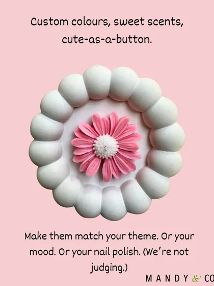 My daisy candles are fully customizable. You can choose custom colors to match your theme, your mood, or even your nail polish. Pictured here is a beautiful pink and white version.
