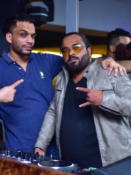 Posing with a fellow artist at an event. I love collaborating with other talents in the industry to create memorable nights.