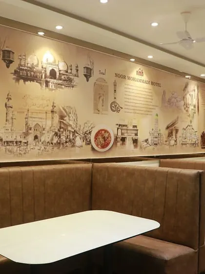 Another view of the main dining hall in Kurla, where our history is painted on the walls for all to see.