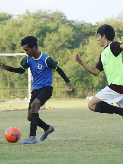 You can't be motivated every day, but you can be disciplined. An action shot from a competitive game, showing players in the heat of the moment.