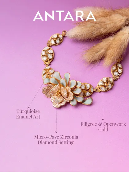 This 22KT matte gold necklace is wearable art. It blends intricate filigree with openwork craftsmanship, blooming into a floral design with turquoise enamel that’s bold, modern, and made to stand out.