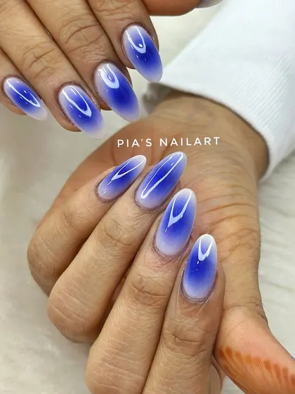 Deep blue aura nails. The airbrush technique creates a beautiful gradient effect that looks like a glowing aura on your fingertips.