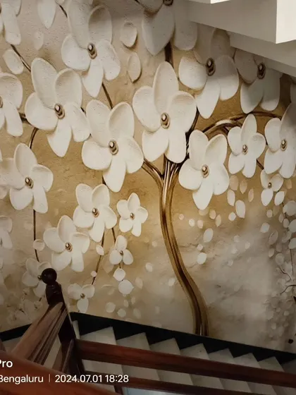 A 3D floral and deer mural installed along a staircase. The design flows down the wall, creating a magical and continuous art piece.