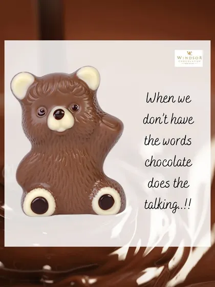 This charming chocolate teddy bear, with its paws up in a wave, is molded from rich, smooth milk chocolate.