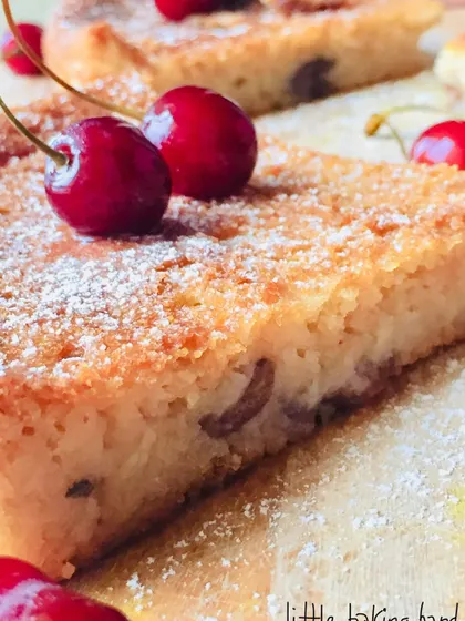 A close-up of a slice of the vegan vanilla cherry lime cake. You can see how moist and tender the texture is.