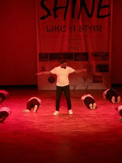 A powerful final pose with the instructor at the center of the group.
