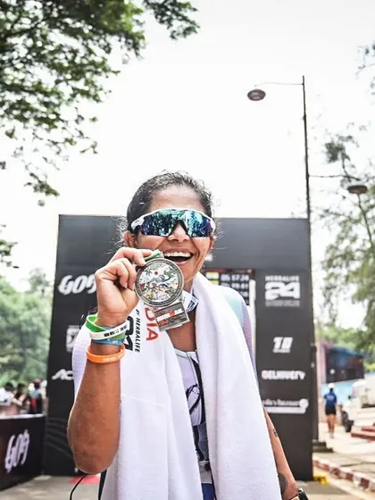 Holding my finisher medal from the Ironman Goa 70.3. A symbol of a tough race fought and finished.