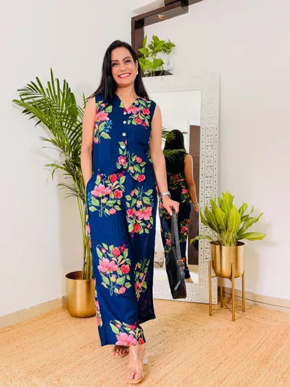 This navy blue floral printed co-ord set is a beautiful and versatile piece. It can be dressed up or down for work or a casual outing.