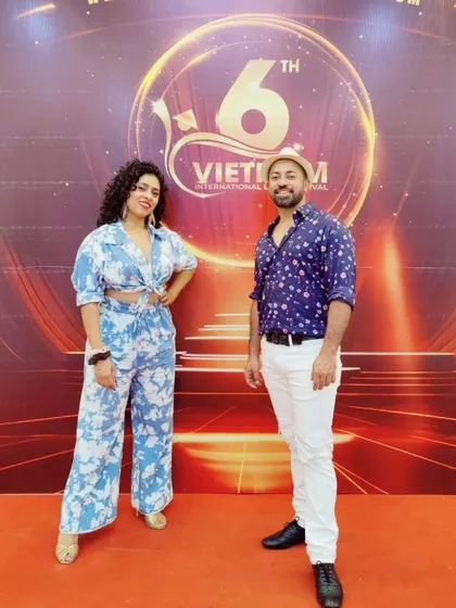 Sai and I on the red carpet in Vietnam. We love representing the Indian Latin dance community on a global platform.