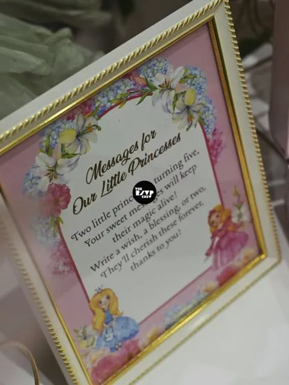 A sweet sign asking guests to write 'Messages for Our Little Princesses' to cherish forever. It's these little details that make a party memorable.