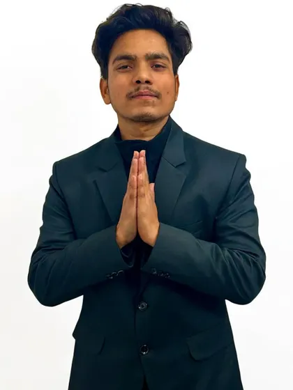A formal pose with a traditional greeting. It represents my respect for the art forms I practice and the people I work with.