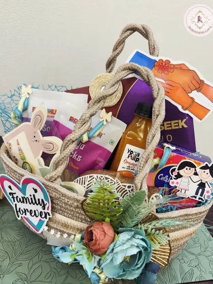 Another "Family Forever" hamper, this one is packed with juices, snacks, and chocolates, all arranged in a beautifully decorated jute basket.