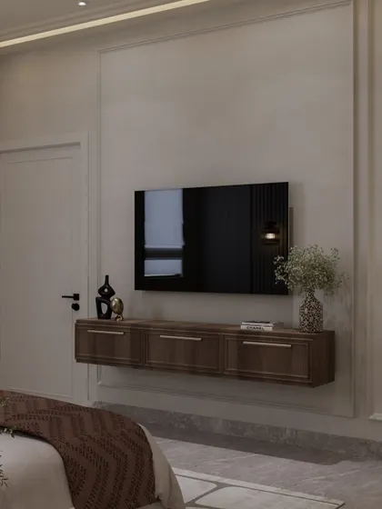 Another view of the floating TV console, framed by classic wall molding. The design focuses on clean lines and thoughtful functionality.