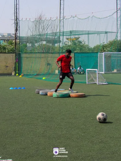 A participant steps through tires in our agility challenge. All fees from this challenge go directly to our foundation partner, Needbase India.
