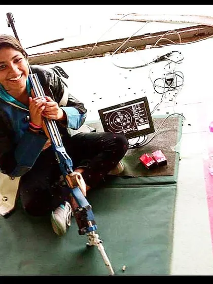 Our star shooter Kanishka taking a moment during a training session with her Feinwerkbau air rifle. The electronic target shows her precise shot.