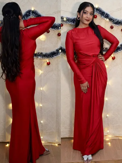 A full view of the red Christmas gown, showing the elegant silhouette and how it pairs with the glam makeup.