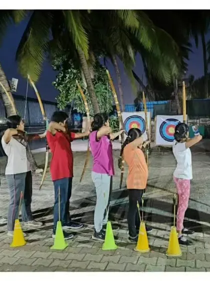 A line of archers getting ready to shoot during an evening session. We ensure everyone has a clear and safe lane for practice.