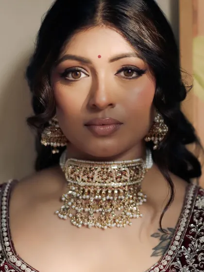 A close-up of Kavi's elegant bridal makeup. Her skin is flawless, and the winged liner adds a touch of classic glamour.