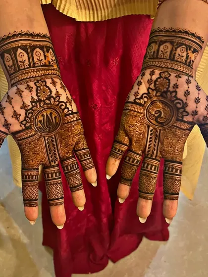 A beautiful design featuring a lotus on one hand and a peacock on the other. This asymmetrical style is modern and allows for more creativity, perfect for someone who wants something unique.
