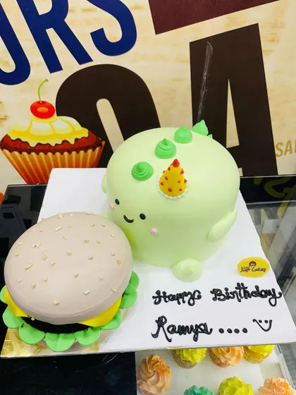 A closer look at the 3kg burger and dinosaur cake duo.