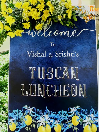 A custom welcome sign for Vishal and Srishti's "Tuscan Luncheon," featuring a beautiful lemon and floral design.