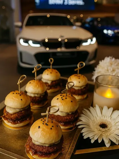 Miniaturized gourmet sliders served at the BMW 2 Series launch. These bite-sized burgers were a huge hit, offering a satisfying and sophisticated snack for guests as they explored the new car.