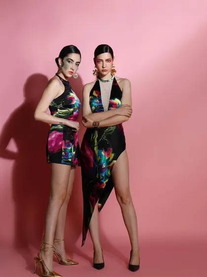 This image showcases my work in creative and art direction for a fashion campaign. I styled these bold, artistic looks with vibrant, abstract-print fabrics and directed the models' strong poses to create a visually striking narrative.