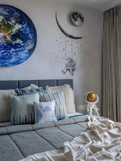 I love crafting personalized themed rooms, like this bedroom for a little explorer. The space-themed wall art, featuring a vivid Earth mural and a dreamy astronaut, is designed to fuel imagination, creating an inspiring space for big dreams and bedtime stories.