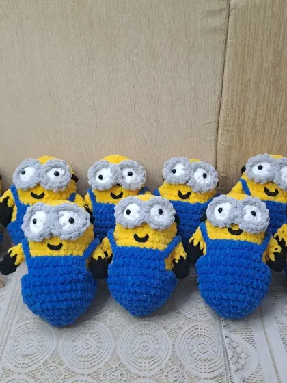 A group of my crochet minion soft toys. These popular characters are a hit with kids and are made with soft, plush yarn.