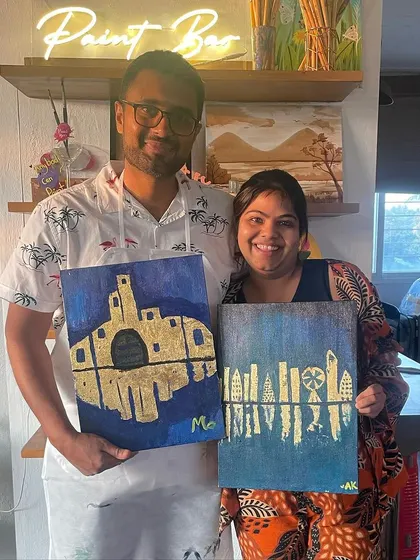 A happy couple with their finished gold leaf paintings. We host open house workshops for this popular technique, so you can come and create your own shimmering masterpiece.