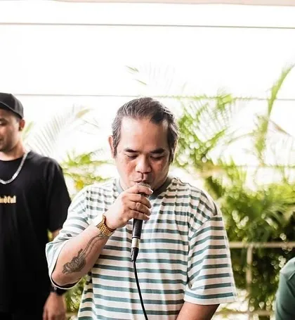 On the mic in the early days. Whether I'm DJing or hosting, it's always been about engaging with the audience.