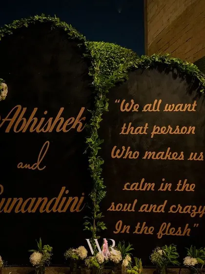 We believe in personal touches that speak from the soul. This custom welcome sign, framed with fresh greenery, shared a beautiful quote about love, setting an intimate and heartfelt tone for Abhishek and Sunandini's cocktail night.