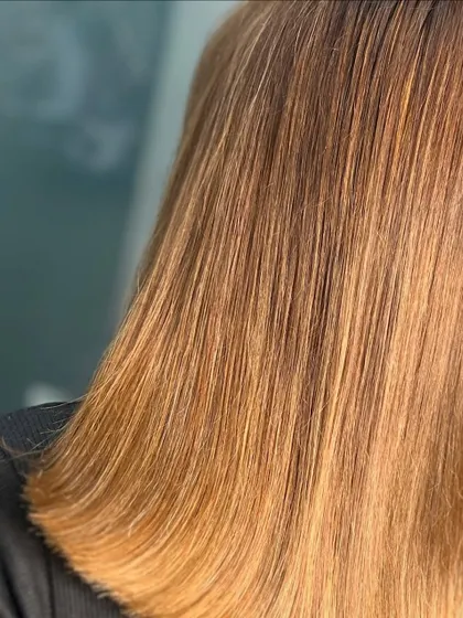 A close-up of a beautiful golden blonde, the ultimate way to lighten up while keeping things natural and glowing.