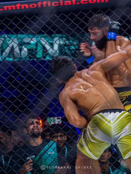A powerful overhand right from Shyamanand connects. Sanjeet's durability was tested throughout this fight.