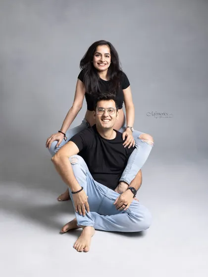 Celebrating love, laughter, and the beautiful journey to parenthood. This playful pose shows the fun and joy of expecting together.