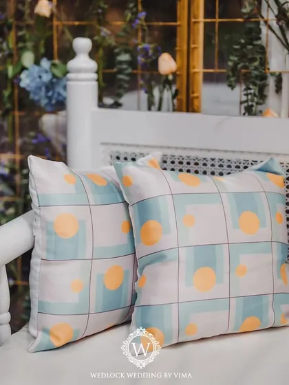 Personalization is key. For this Mehendi, we crafted custom cushions with themed linen to match the pastel decor, adding a stylish and cohesive touch to the lounge seating.