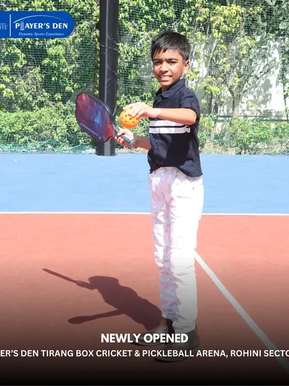 A young boy gets ready to try his hand at pickleball during the opening of our Rohini facility. We aim to introduce new and exciting sports to the community.