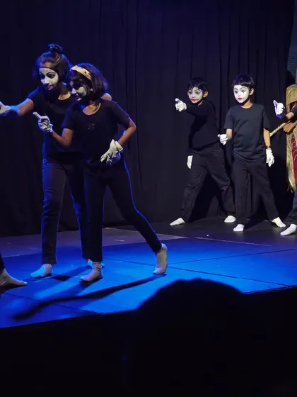 Expressing without words. Students in our children's theatre program learn the art of mime, developing physical expression and non-verbal communication skills. It's amazing to see them command the stage with just their movements and expressions.